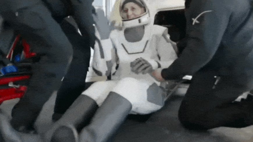 Sunita Williams smiles and waves after returning to Earth